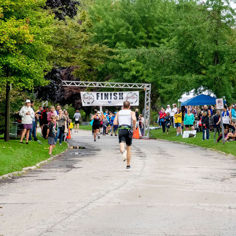 Person running toward the finish line.